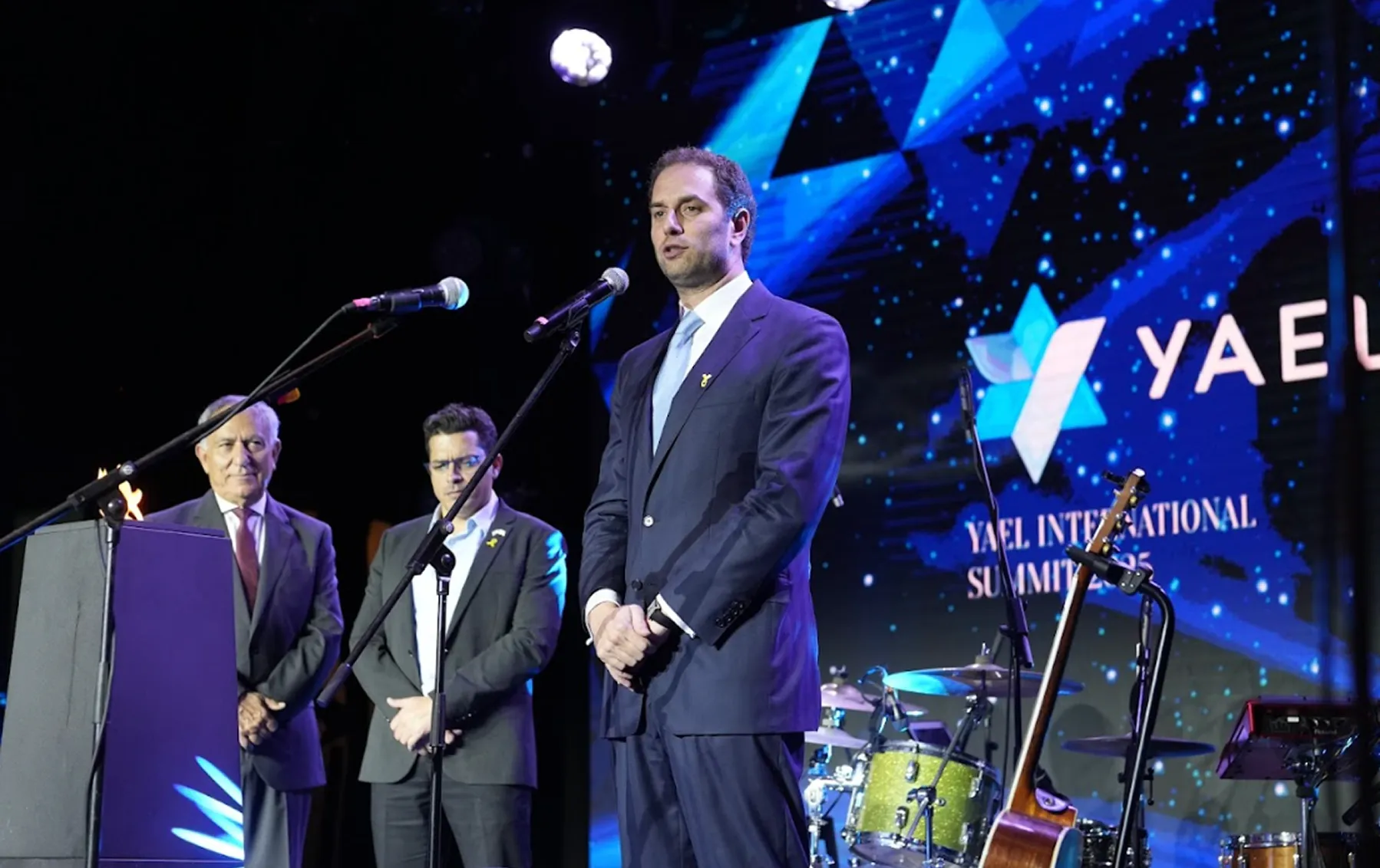 Speakers addressing the audience at the summit